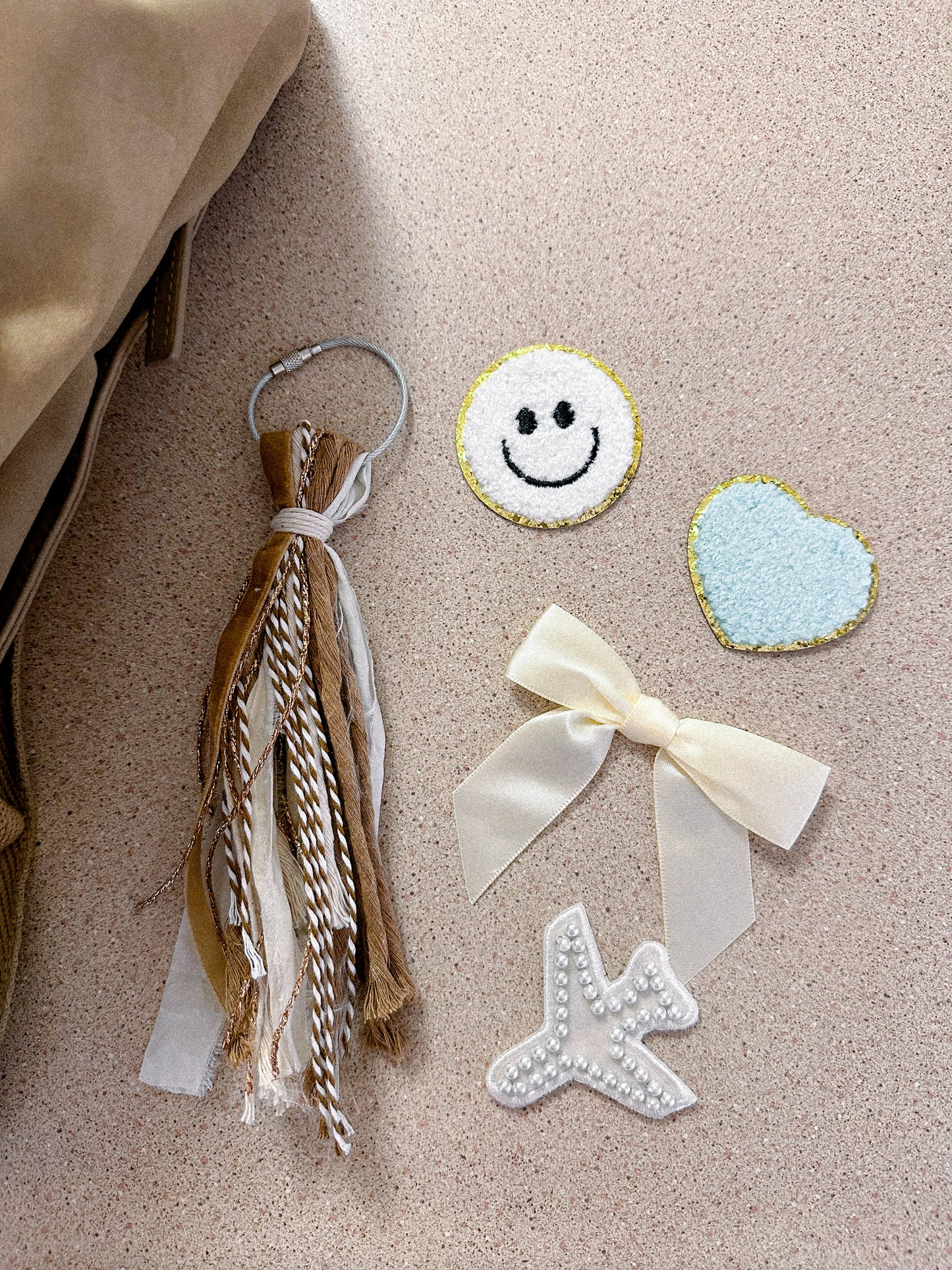 initial bag tassel neutral