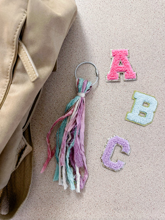 initial bag tassel pink/purple/teal